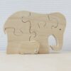 Puzzelolifant met jong naast elkaar