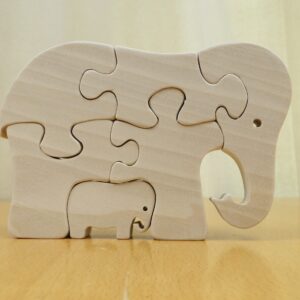 Puzzelolifant met jong in elkaar